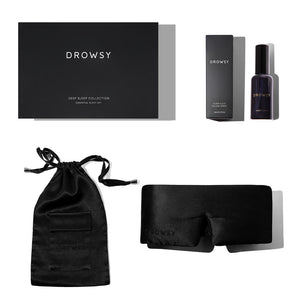 The Black Jade – Deep Sleep Collection by us.drowsysleepco features a luxury silk sleep mask, deep sleep pillow spray with box, black drawstring pouch, and sleek black box—elegantly arranged on a white background.