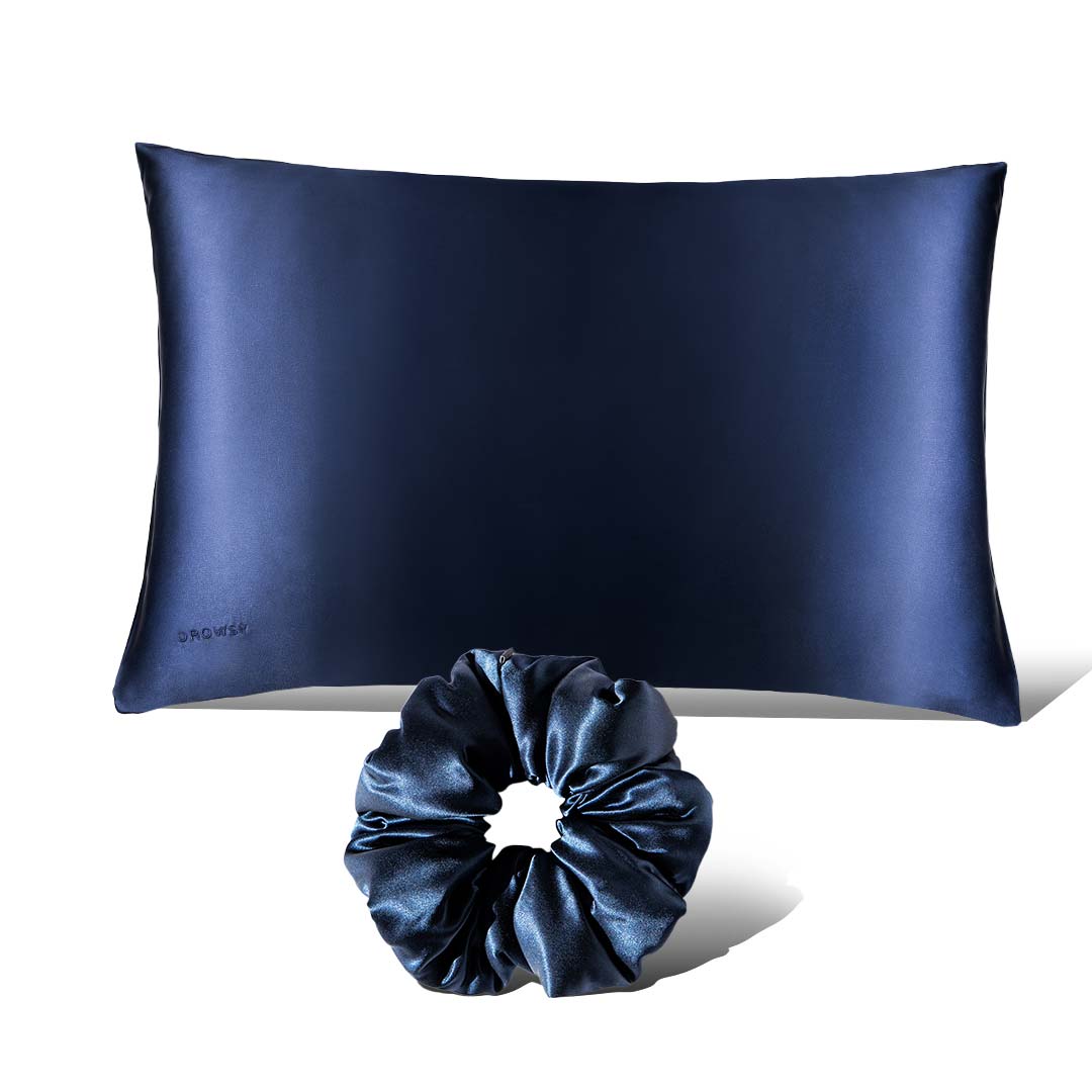 The Perfect hair bundle Midnight Blue by drowsysleepco features a navy silk pillowcase and a matching Silk Padded Scrunchie, both shown on a white background.