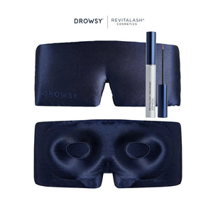 The Drowsy RevitaLash® Cosmetics x Drowsy® Dream Lashes Kit features a navy blue eyelash protecting mask shown front and back, plus a RevitaLash Advanced Eyelash Conditioner with applicator, all against a white background.