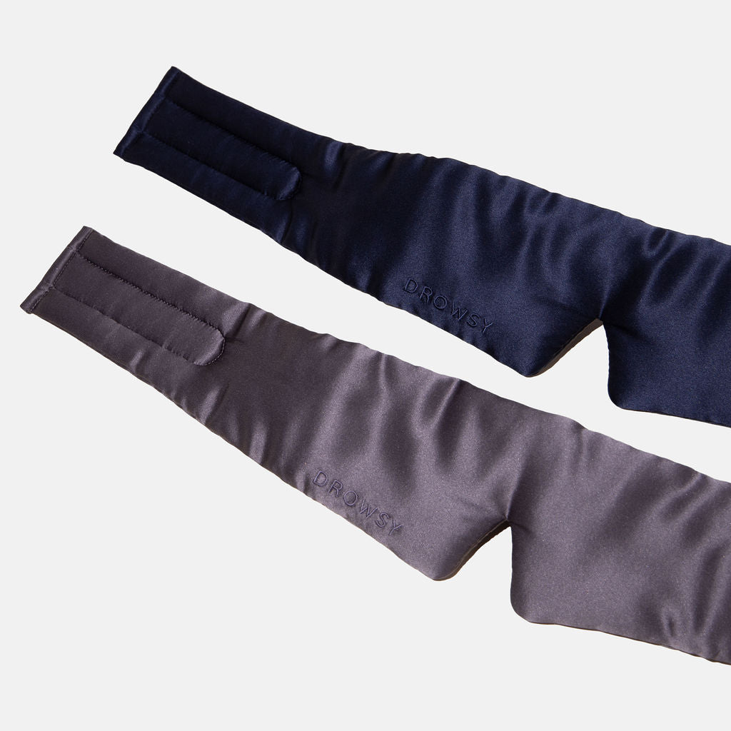 The Drowsy Lovers Pack features two padded, contoured luxury mulberry silk sleep masks in navy blue and dark gray with adjustable Velcro straps and DROWSY embroidery, perfect for ultimate beauty sleep.