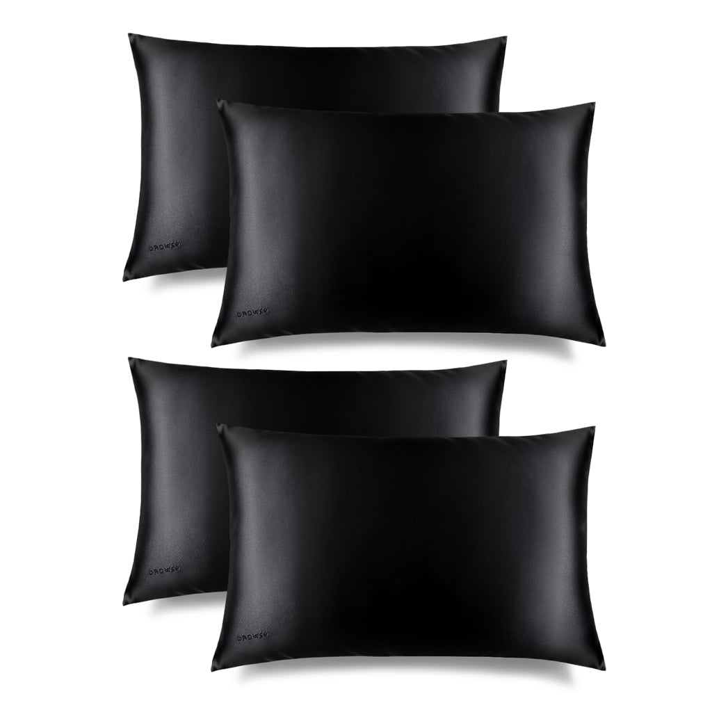 Four us.drowsysleepco Black Jade Silk Pillowcases, essential for skincare and beauty, are displayed in two rows on a white background. Each smooth, shiny pillowcase features a subtle logo in the lower left corner.