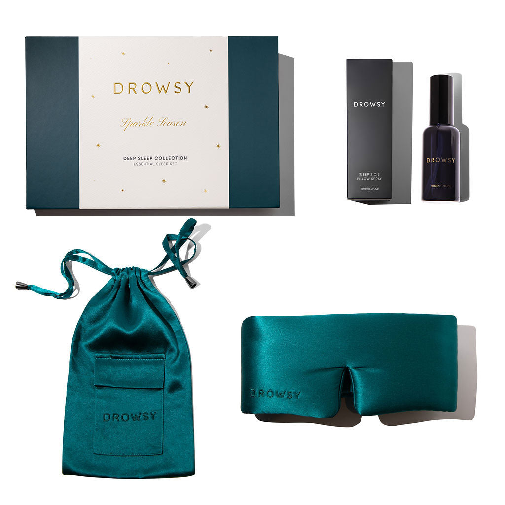 The us.drowsysleepco Green Sapphire - Deep Sleep Collection features a teal silk sleep mask, matching pouch, deep sleep pillow spray, and a dark teal and white gift box—your essential set for restful nights.
