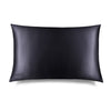 The Moonlight Shadow Silk Pillowcase by us.drowsysleepco features a smooth black rectangular design with a subtle sheen, ideal for skin and hair care, and has "DROUZZE" discreetly printed on the bottom left against a white background.