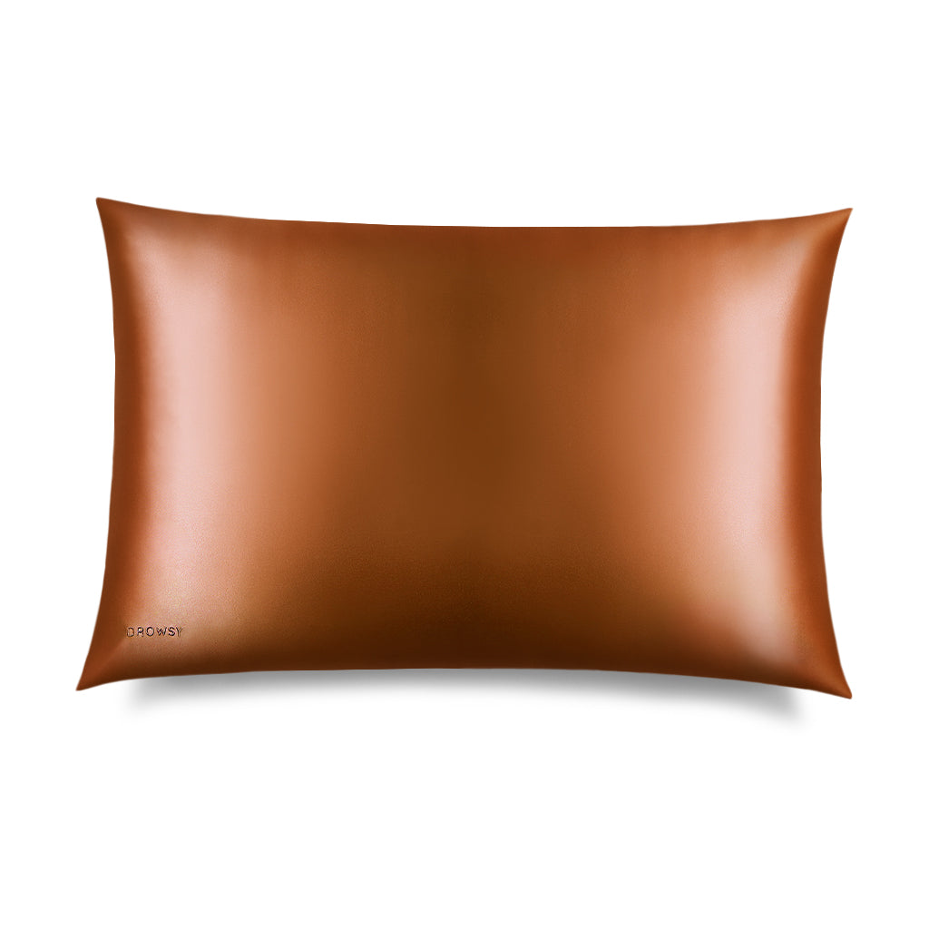 The us.drowsysleepco Pumpkin Spice Silk Pillowcase, a rectangular smooth brown case with a subtle sheen, is shown against a white background. 