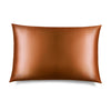 The us.drowsysleepco Pumpkin Spice Silk Pillowcase, a rectangular smooth brown case with a subtle sheen, is shown against a white background. "DROWSY" is printed at one corner, making it a hair-protecting and skincare essential.