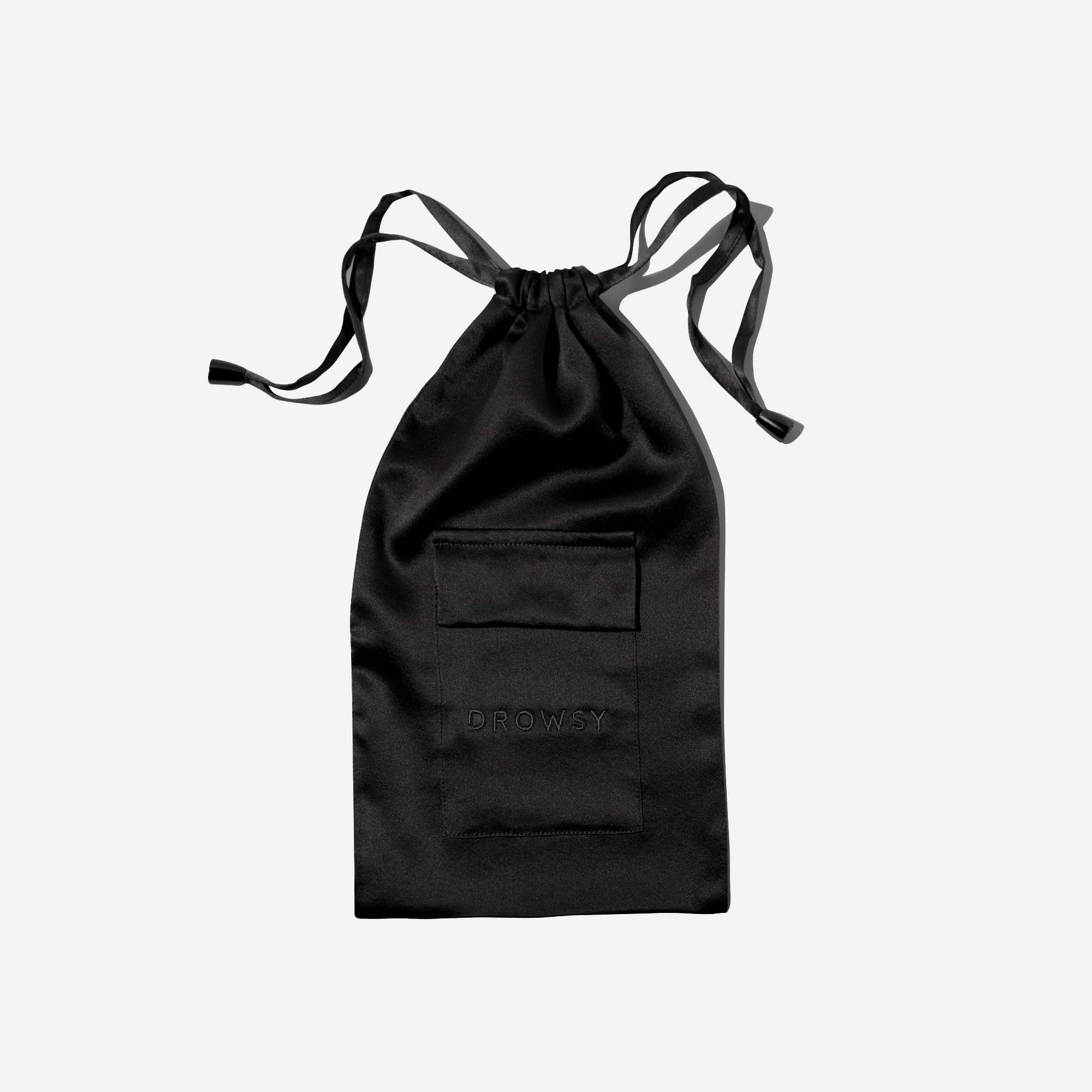 A black satin drawstring pouch with a small rectangular pocket on the front and the word DROWSY subtly embossed below the pocket, set against a plain white background.