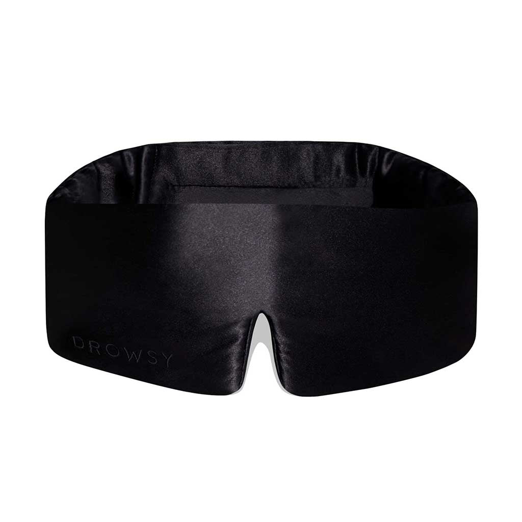 The Black Jade eye mask by us.drowsysleepco features a contoured black silk design with a bottom center notch for comfort, and Drowsy subtly embossed on the lower left—perfect for enhancing your beauty sleep.