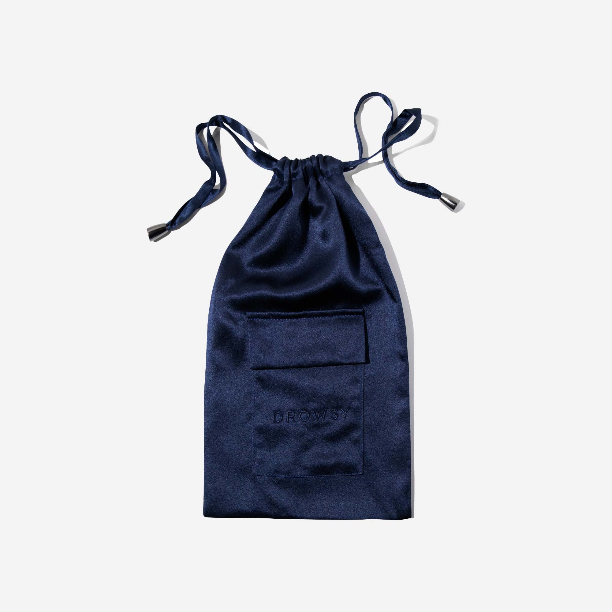 A navy blue satin drawstring pouch with a small front pocket and the word DROWSY subtly embossed on the fabric, displayed on a plain white background.