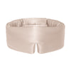 The Dusty Gold eye mask by drowsysleepco is a beige silk mask with DROWSY in small letters on the left, featuring a wide, cushioned blackout design and a small notch at the bottom center.