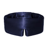 A woman in a white shirt lies on white bedding, bathed in soft natural light, enjoying beauty sleep as the us.drowsysleepco Midnight Blue mask enhances her skin hydration overnight.