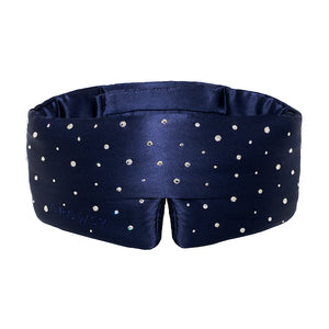 The Silk Sleep Eye Mask Crystals by Swarovski® from drowsysleepco is a navy silk eye mask with sparkling Swarovski crystals, a wide padded design for 100% blackout, and Drowsy subtly embossed on the left side.