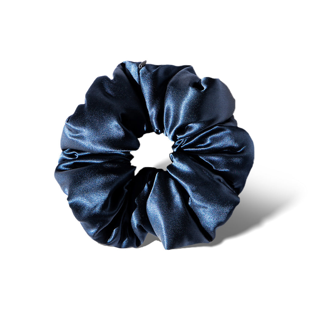 The us.drowsysleepco Midnight Blue - Padded Scrunchie, a dark blue oversized silk accessory, is shown on a white background with a soft shadow—ideal for boosting hair volume and promoting hair health.