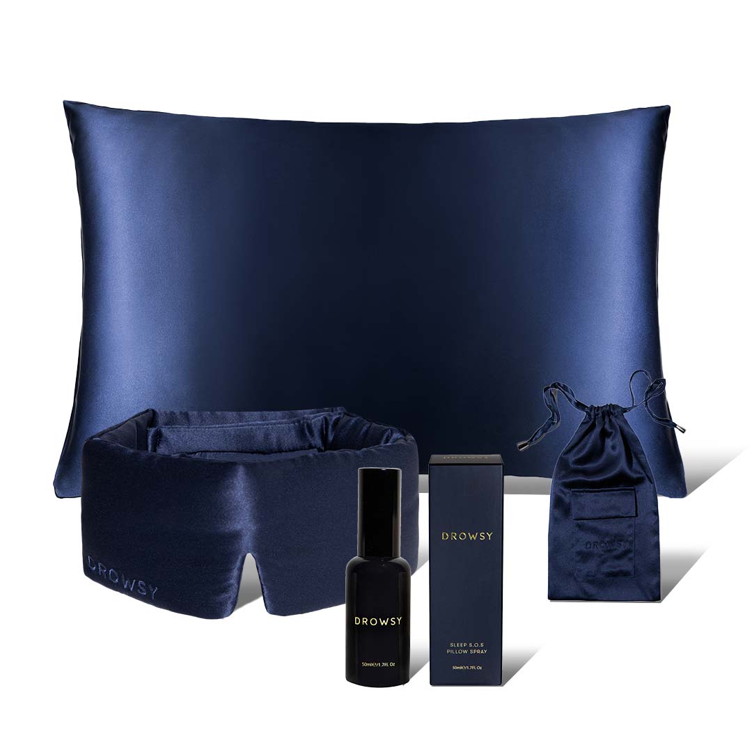 The drowsysleepco Midnight ritual bundle in Midnight Blue includes a pillowcase, sleep mask, spray bottle, pouch, and box, all beautifully displayed on a white background.