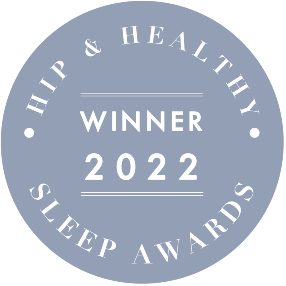 A round, grey badge with white text reads: Hip & Healthy Sleep Awards Winner 2022.