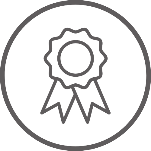 A dark gray outline of an award ribbon with two tails inside a circular border, set against a darker gray background.