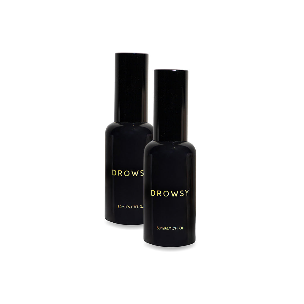 Two black Sleep S.O.S Pillow Spray bottles by us.drowsysleepco stand upright on a white background—an ideal pillow spray to enhance your nighttime ritual and support a natural sleep aid routine.